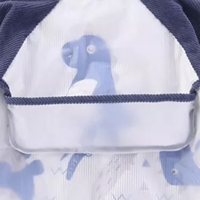 Bib i papërshkueshëm nga uji me mëngë pambuku dhe xhep me sumboll blue dinosaur